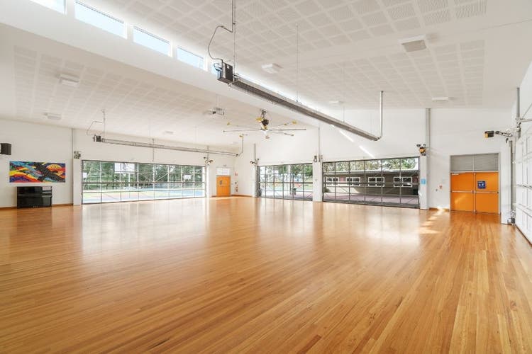 The internal space of the empty school hall.