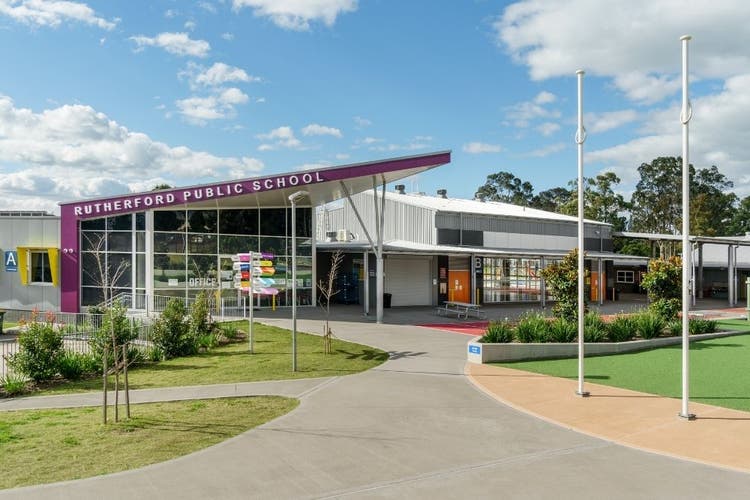 The front of the school administration building with the words